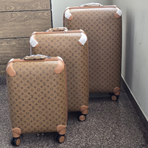 Louis Vuitton Hard-Shell Luggage in a Monogram Design with Brown Accents