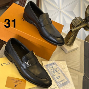 Louis Vuitton Loafers with a Black Embossed Pattern