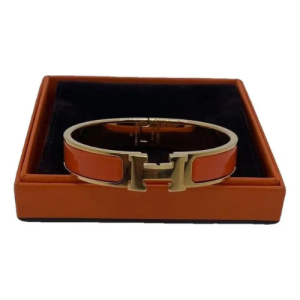 Hermes Bracelet With a Burnt Orange and Gold Design