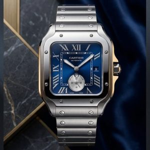 Cartier Watch With A Blue Dial And Silver Stainless Steel Finish.